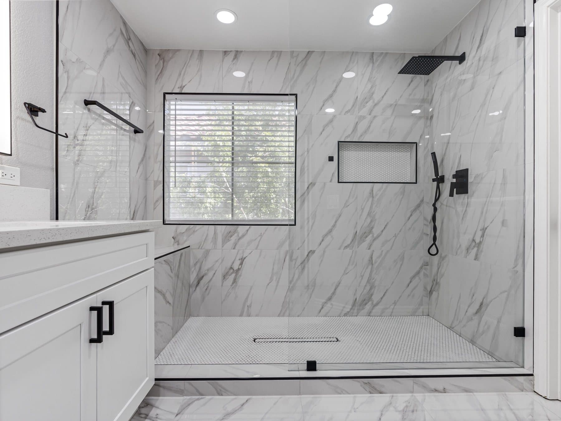 Summerlin bathroom remodel: walk-in shower with marble-look tile, niche and linear drain